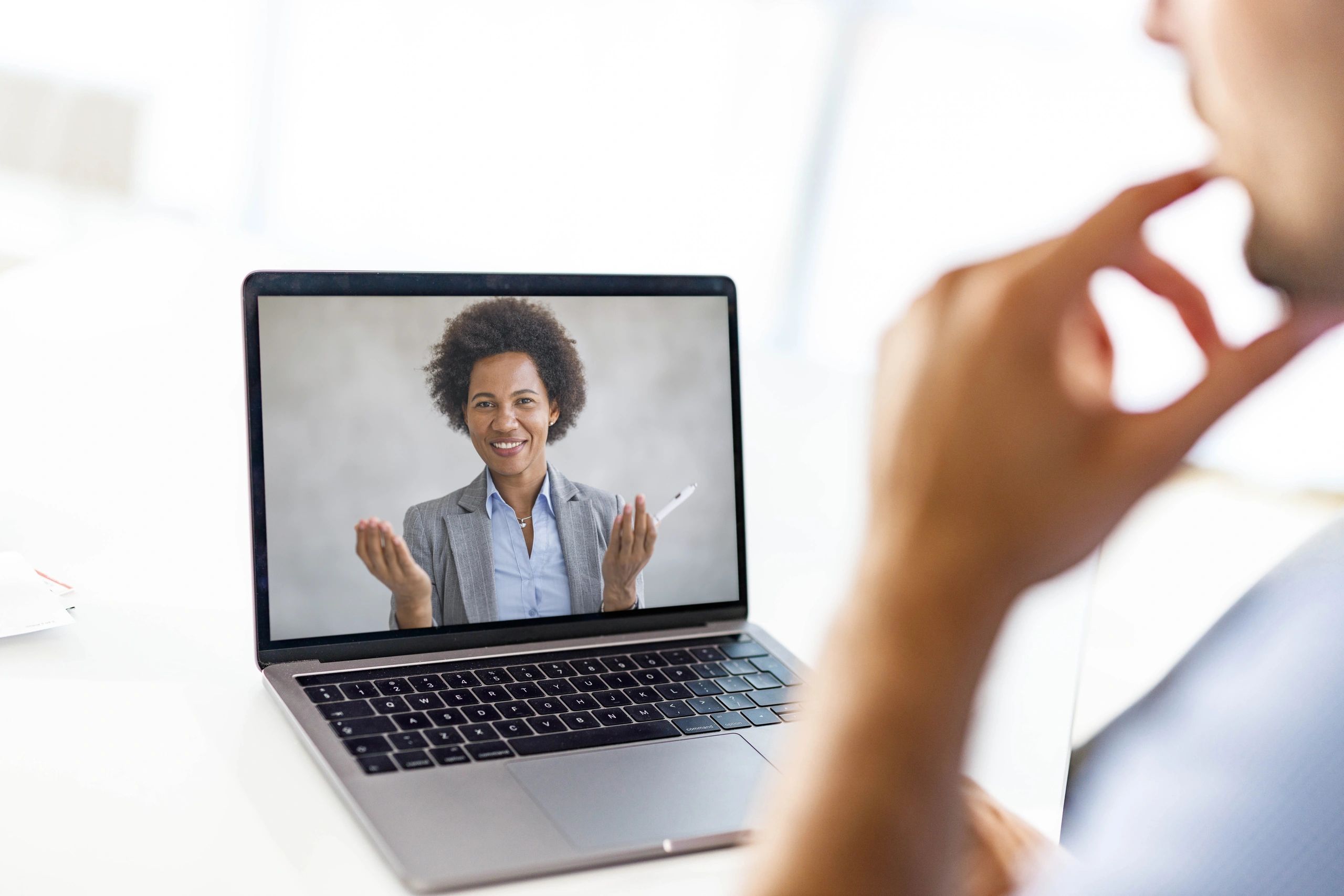 Professional on a video call during a coaching session