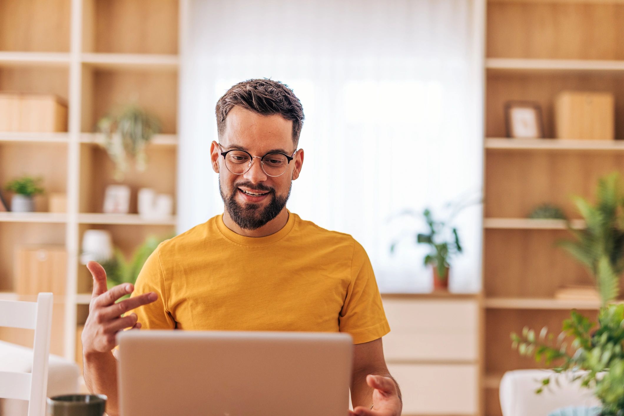 Professional working remotely on a laptop during a video call